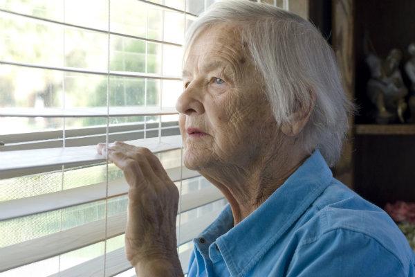 Woman looking through window